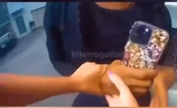 Tense Confrontation Between Police Officer and Young Woman Captured on Video